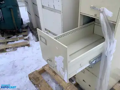 Lot of (2) metal filing cabinets with 4 drawers approx. 15”x29”x52” (one has handles)