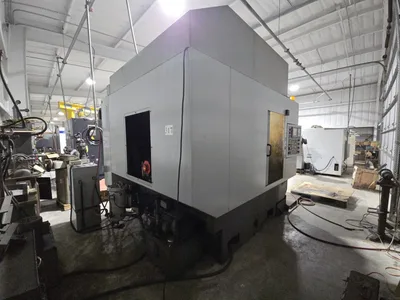 Hyundai HI-V50D VMC w/ 30-Slot ATC, Conveyor, (2) Kurt Vise, Fanuc Oi-MC Controller