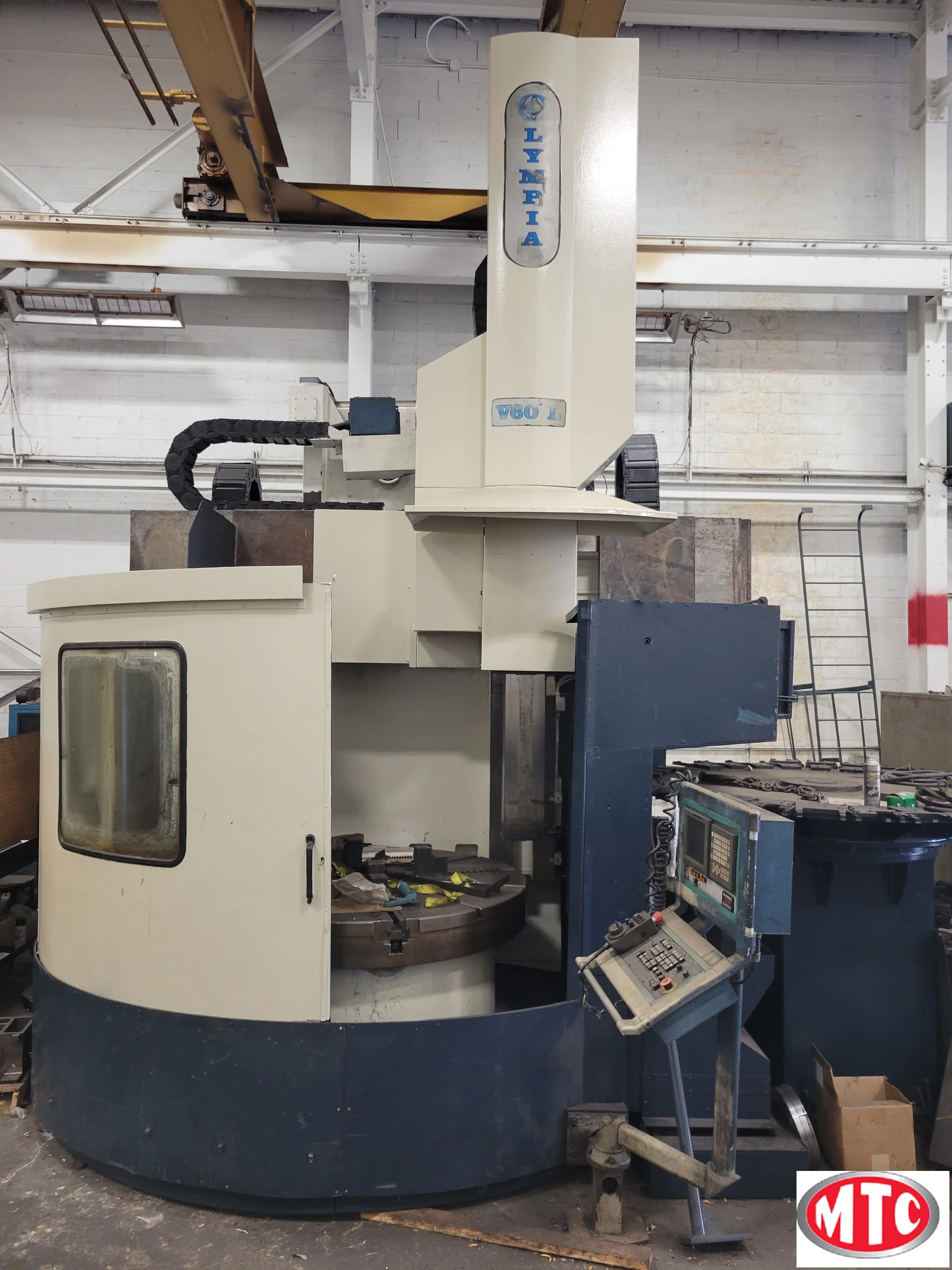 Olympia 70", CNC VTL, Fanuc 180i-T, "C" axis Live tool, 30 ATC, Movable column, 66" table