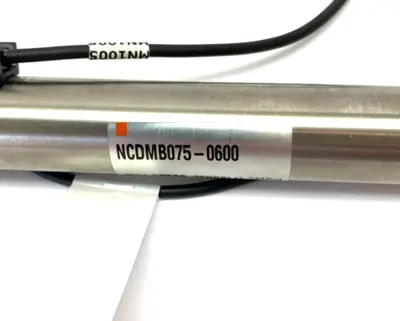 NCDMB075-0600, BMF 307K-PS-C-2-SA95-S75-00,3 | SMC NCDMB075-0600 Air Cylinder w/ Balluff BMF 307K-PS-C-2-SA95-S75-00,3 Sensor - Used